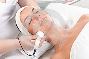 Facial treatment in beauty saloon photo