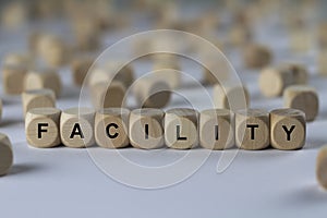 Facility - cube with letters, sign with wooden cubes