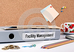 Facility Management. Folder on office deskn photo