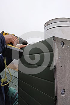 Facing a new chimney on a new two-story house