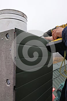 Facing a new chimney on a new two-story house