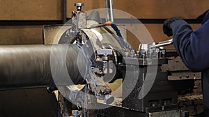 Facing operation of a metal blank on turning machine with cutting tool.Old turning lathe machine in turning workshop