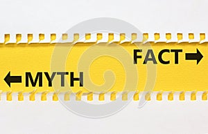 Fact or myth symbol. Concept word Myth and Fact on beautiful yellow paper. Beautiful white paper background. Business and fact or