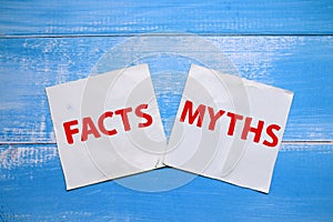 Fact or myth, text words typography written on paper against wooden background, life and business motivational inspirational