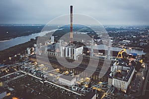 Factory aerial view under dark cloudy sky photo