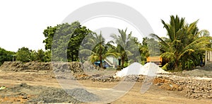 Factory building exterior with warehouse. coconut tree in nature background