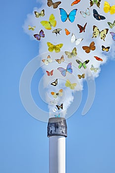 Factory chimney emitting fumes with flying butterflies
