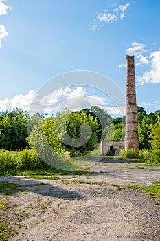 Factory chimney. Old crumbling pipe made of bricks. Steadicam shot