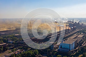 Factory chimneys emit a caustic chemical fume that disrupts the city's ecology