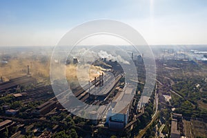 Factory chimneys emit a caustic chemical fume that disrupts the city's ecology