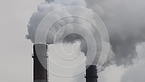 Factory chimneys smoking with dense white smoke. Industrial pollution of air, electric plant emission,  environment ecology proble