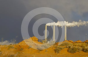 Factory chimneys with white smoke