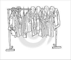 factory clothes gowns, jerseys and helmets hanging on a hanger