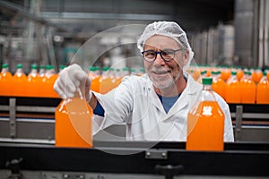 Factory engineer examining a bottle of juice