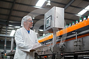 Factory engineer maintaining record on clipboard in factory