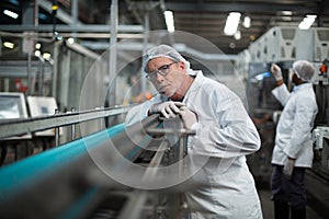 Factory engineer monitoring production line