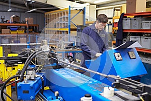 Factory Engineer Operating Hydraulic Tube Bender