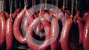 Factory fridge with smoked sausages preserved in it