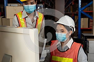 Factory industry worker working with face mask to prevent Covid-19