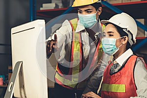 Factory industry worker working with face mask to prevent Covid-19