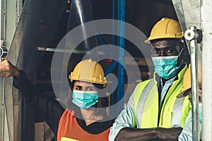 Factory industry worker working with face mask to prevent Covid-19