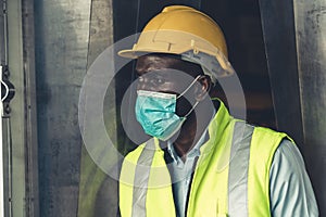 Factory industry worker working with face mask to prevent Covid-19