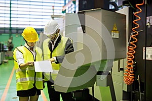 Factory inspector check microchip mock up model at machinery