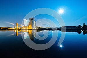 A factory in the light of a full moon