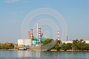 Factory with lot of chimneys on the riverside