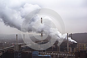 Factory with many smokestacks and big smoke, air pollution