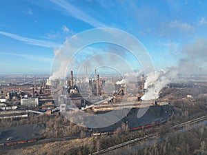 Factory metal steel processing hot, drone aerial video shot, smoke chimneys rises black poison, smog in city Ostrava