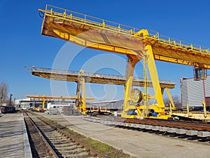 Factory overhead crane with electromagnetic beam on a yellow beam. Close up
