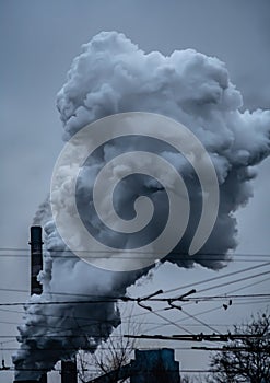 Factory pipe polluting air against, environmental problems, smoke from chimneys