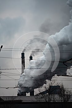 Factory pipe polluting air against, environmental problems, smoke from chimneys