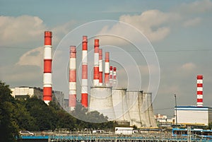 Factory pipes on a background of a city landscape of a city of Moscow