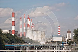 Factory pipes on a background of a city landscape of a city of Moscow.