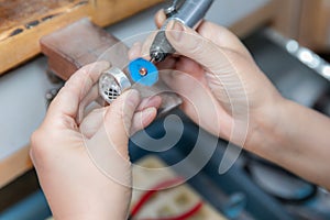 Factory for the production of jewelry, workers are making and polishing jewelry