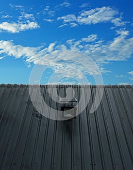 Factory roof solar Blue sky and white fluffy clouds. Clean energy concept. and reduce costs photo