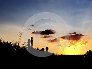 Factory on sky sunset background.on sky sunset background