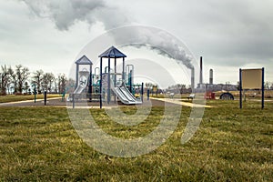 Factory Smokestack Behind Playground