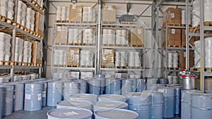 Factory warehouse filled with huge amount of pails and barrels