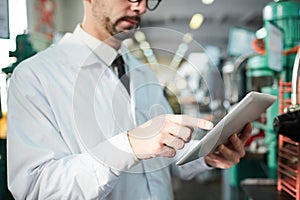 Factory Worker Holding Tablet