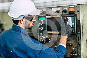 Factory worker man operate the machine, high skill labor work industry with safety clothes