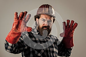 factory worker mechanic. industrial worker in helmet. man in gloves. construction worker in hard hat. engineer architect