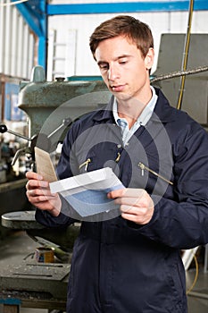 Factory Worker Opening Wage Packet photo