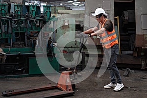 Factory worker with pallet jack