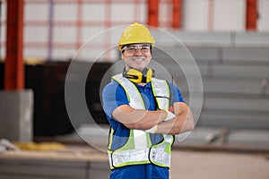 Factory worker pose in the steel factory
