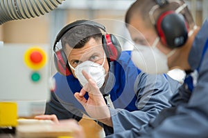 factory worker showing ok sign