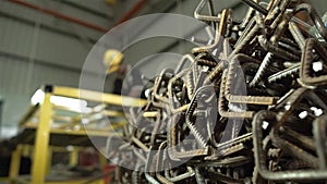 Factory Worker In Yellow Cap Working On Construction Product - Slider - Moving Towards