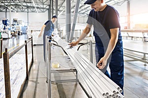factory workers engineer checks the quality of polypropylene pipes